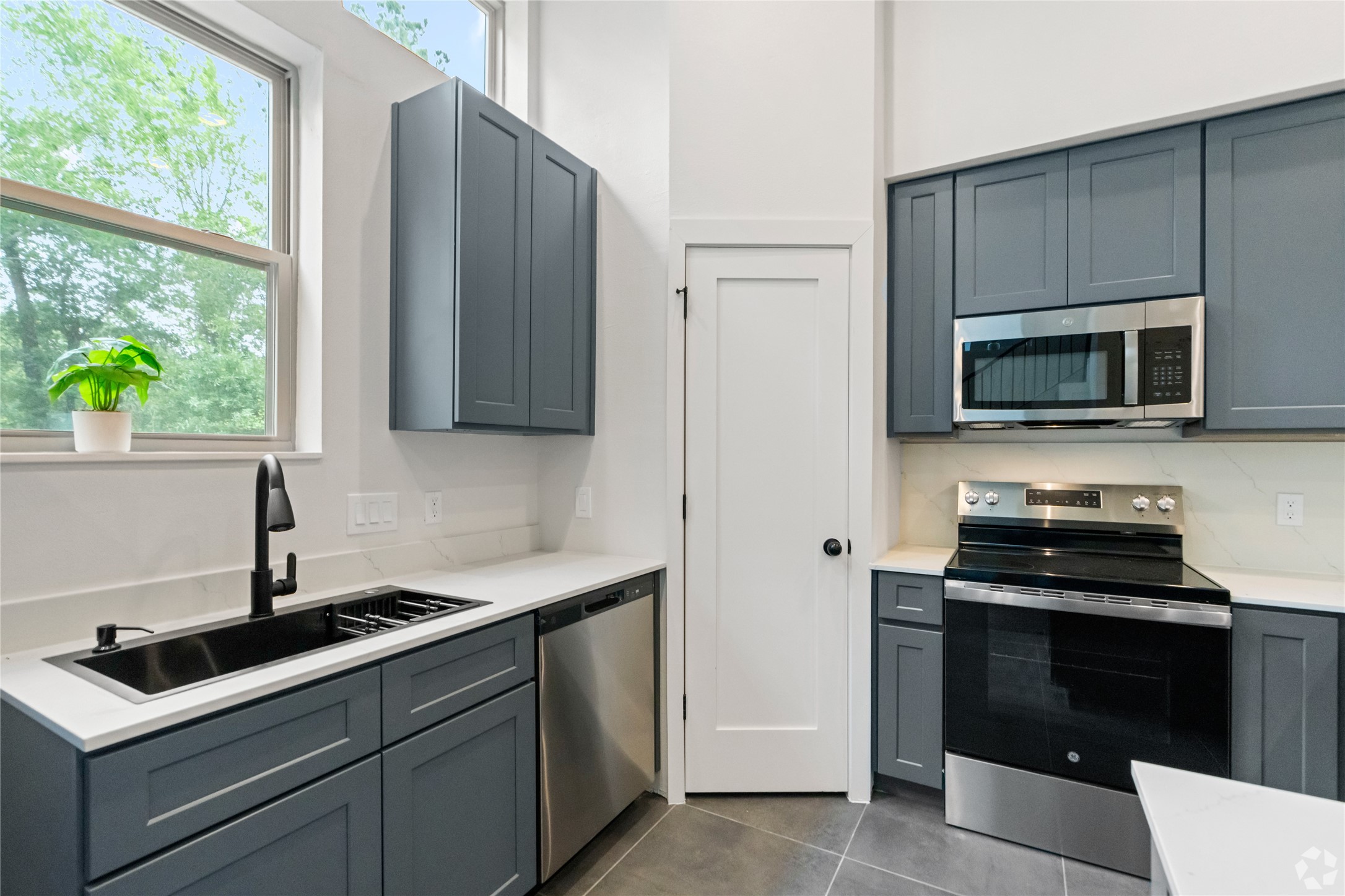 13106 Beauty Berry Ridge Lane Cypress, TX 77429 - Photo 7 of 24 a kitchen with a sink and a stove top oven