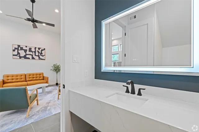 a bathroom with a sink and a mirror