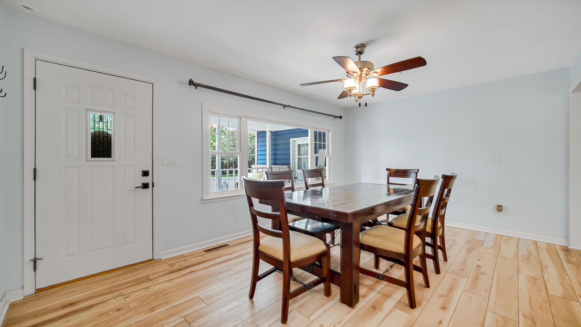 6717 State Rte 49 Rensselaer, IN 47978 - Photo 5 of 31 a view of a dining room with furniture and wooden floor