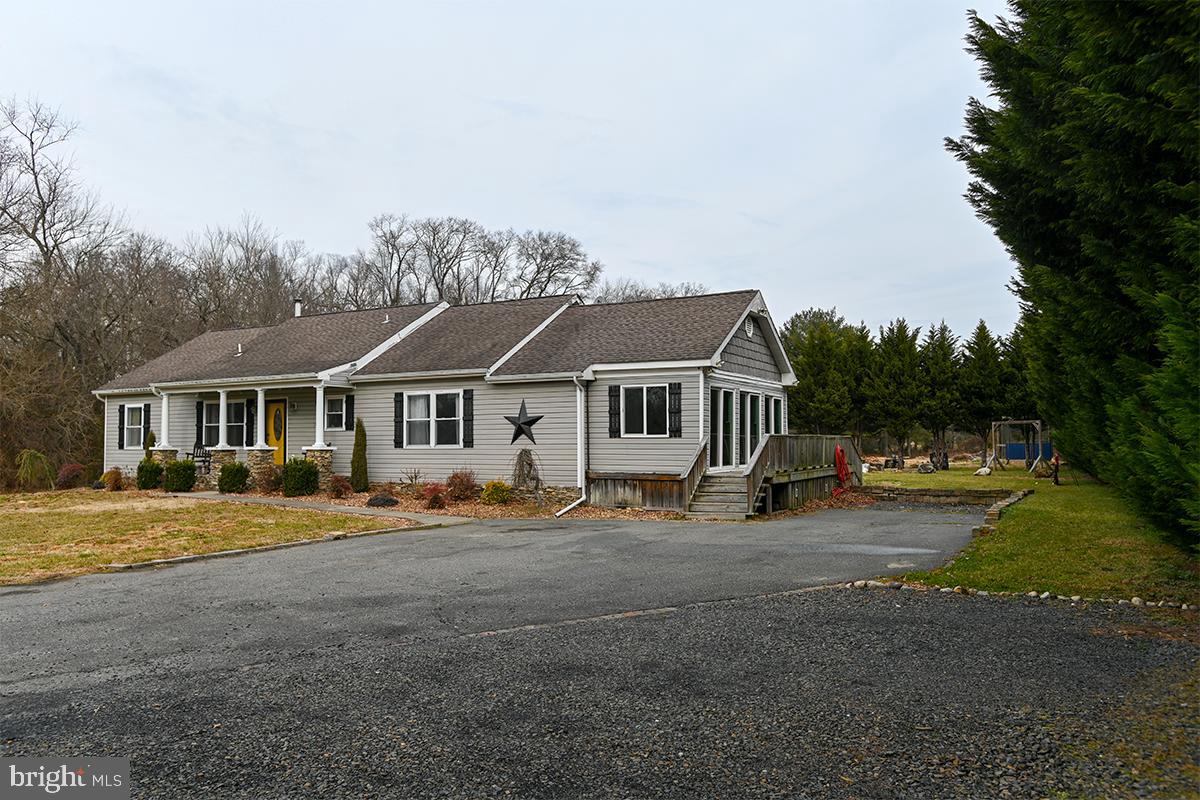 368 Almond Road Pittsgrove, NJ 08318 - Photo 2 of 40 a view of a big house with wooden fence