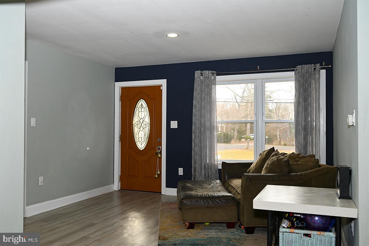 368 Almond Road Pittsgrove, NJ 08318 - Photo 27 of 40 a living room with furniture a window and wooden floor