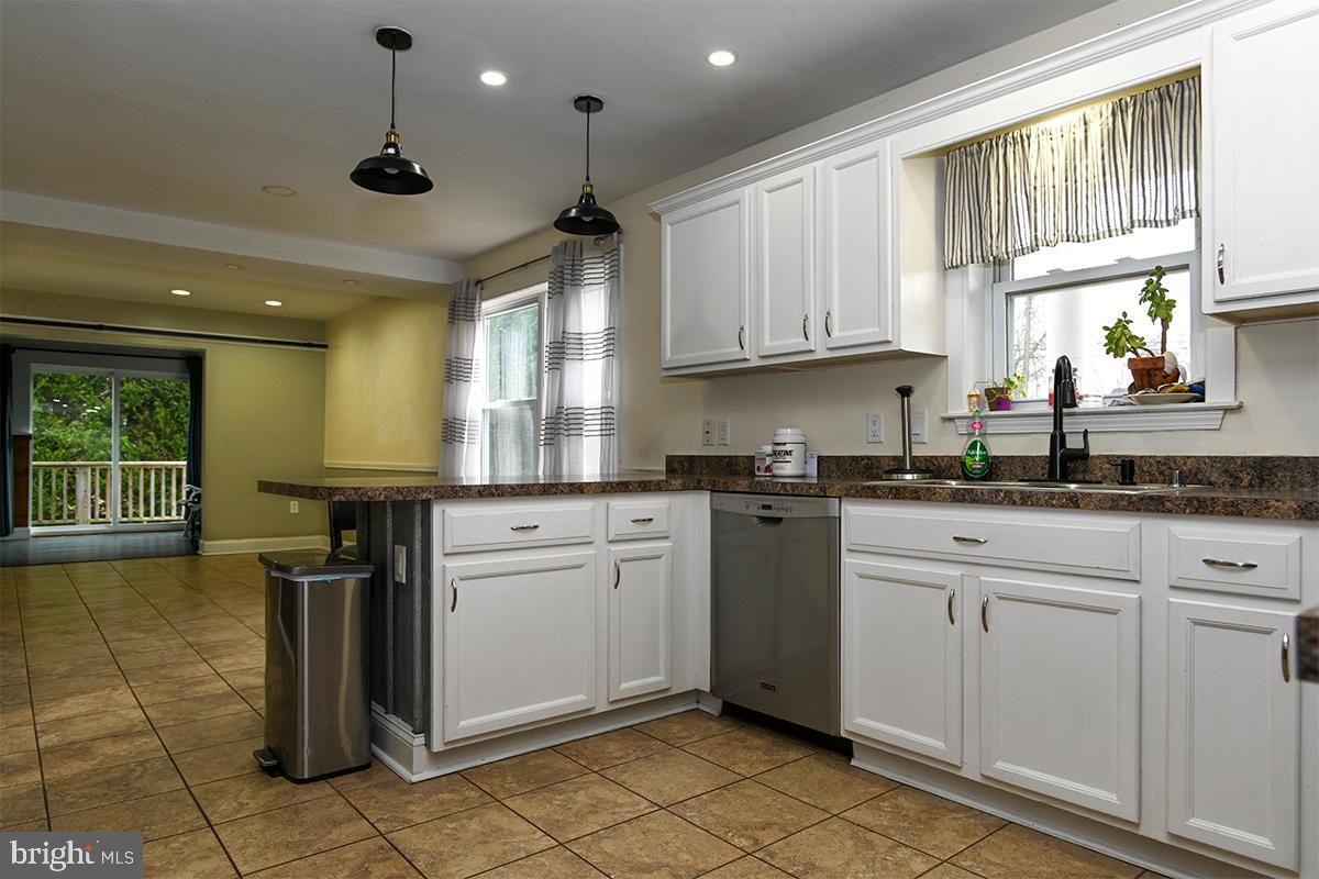 368 Almond Road Pittsgrove, NJ 08318 - Photo 35 of 40 a kitchen with a sink window and cabinets