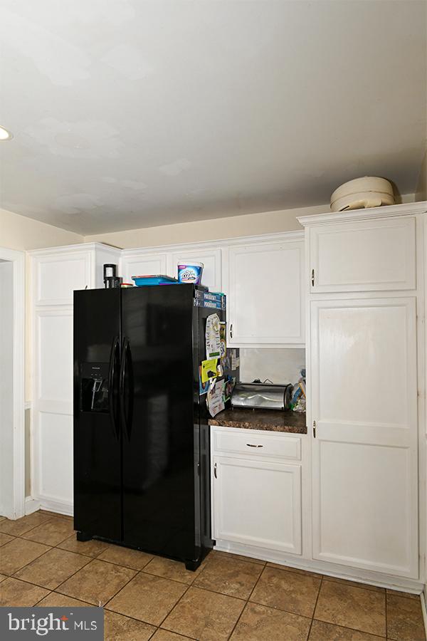 368 Almond Road Pittsgrove, NJ 08318 - Photo 36 of 40 a view of a refrigerator in kitchen and an empty room
