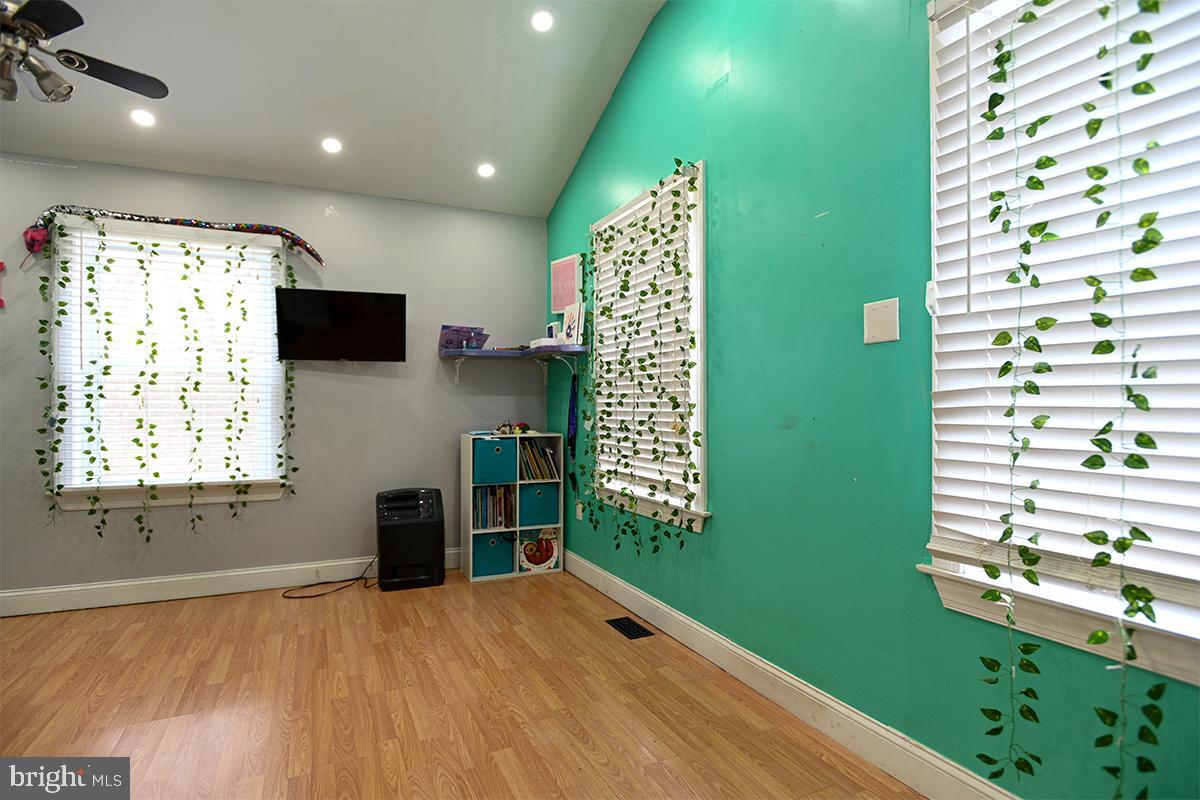 368 Almond Road Pittsgrove, NJ 08318 - Photo 38 of 40 a room with window cabinet and a flat screen tv