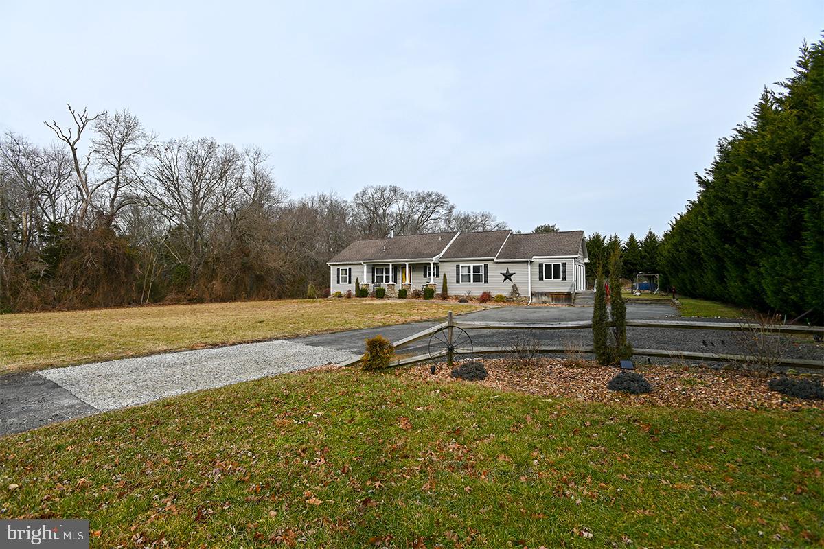 368 Almond Road Pittsgrove, NJ 08318 - Photo 39 of 40 a house view with a bench in front of it