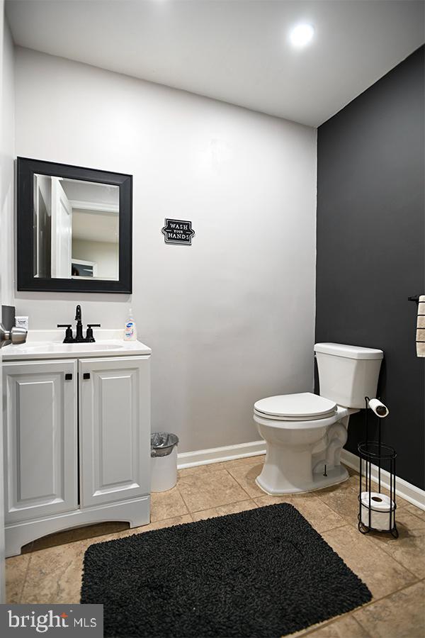 368 Almond Road Pittsgrove, NJ 08318 - Photo 40 of 40 a bathroom with a toilet a sink and mirror