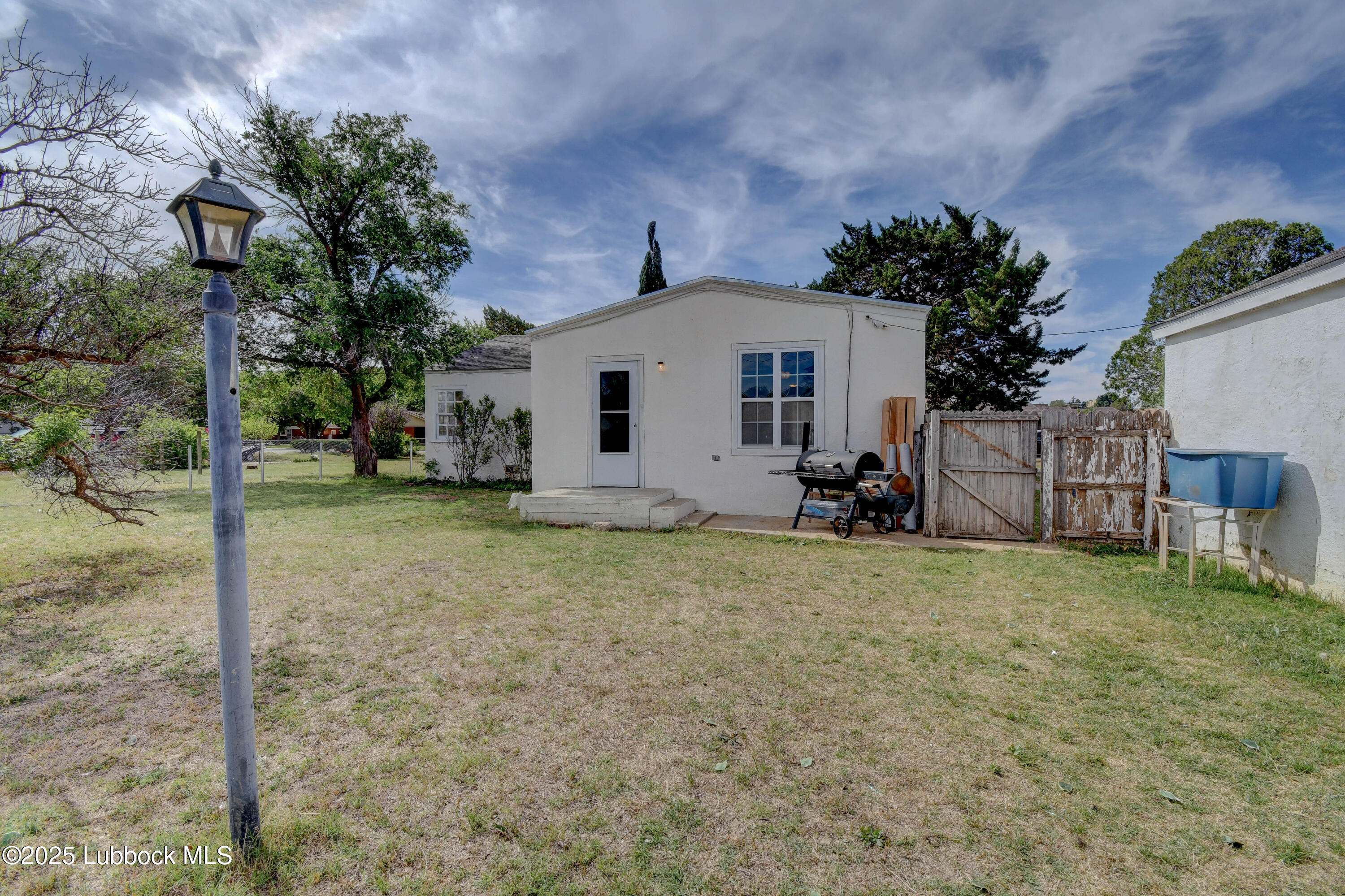 1130 West Garza Street Slaton, TX 79364 - Photo 16 of 16 a view of a house with backyard