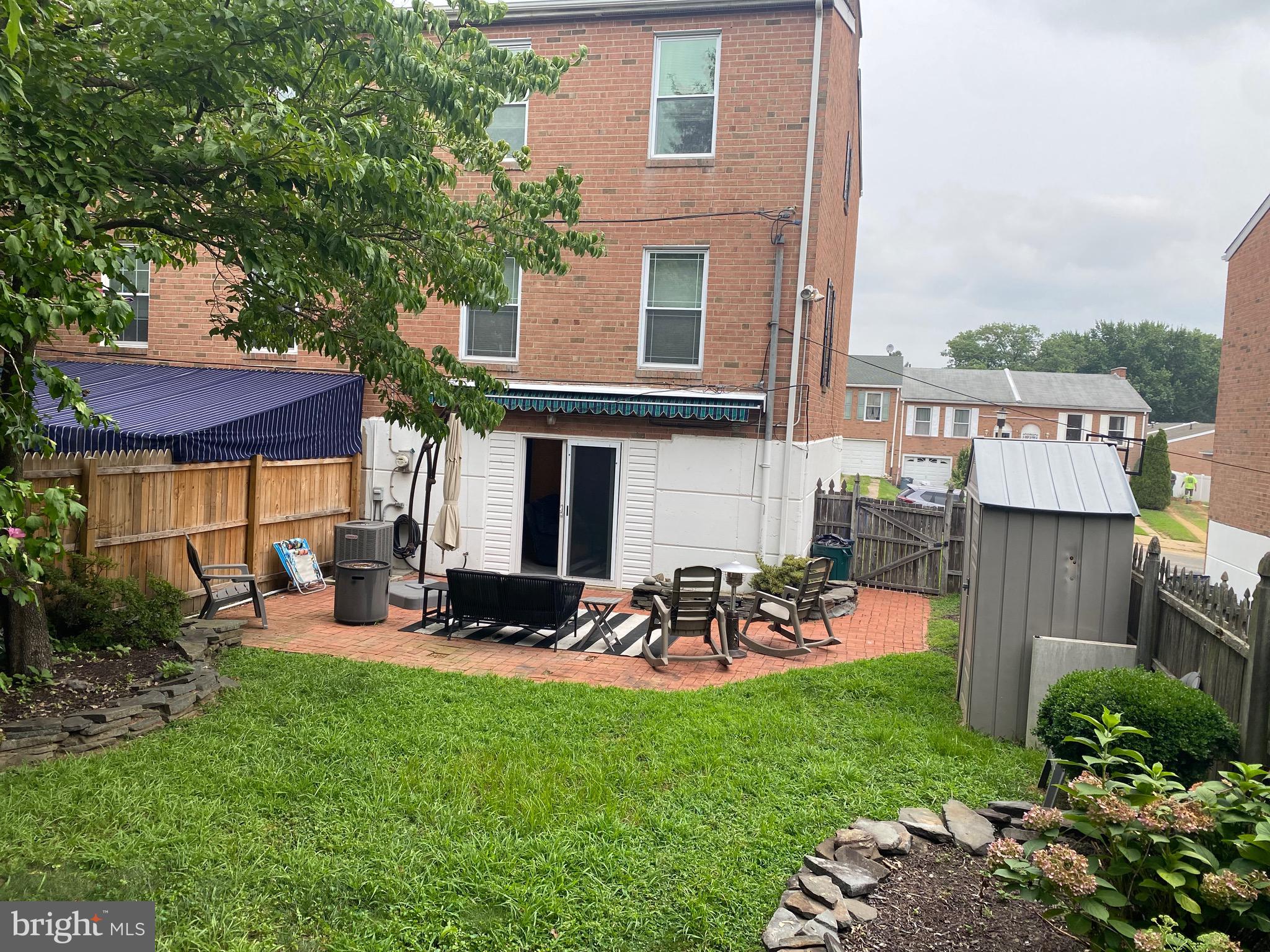 220 Goodford Road Philadelphia, PA 19154 - Photo 4 of 28 a view of a patio with table and chairs under an umbrella
