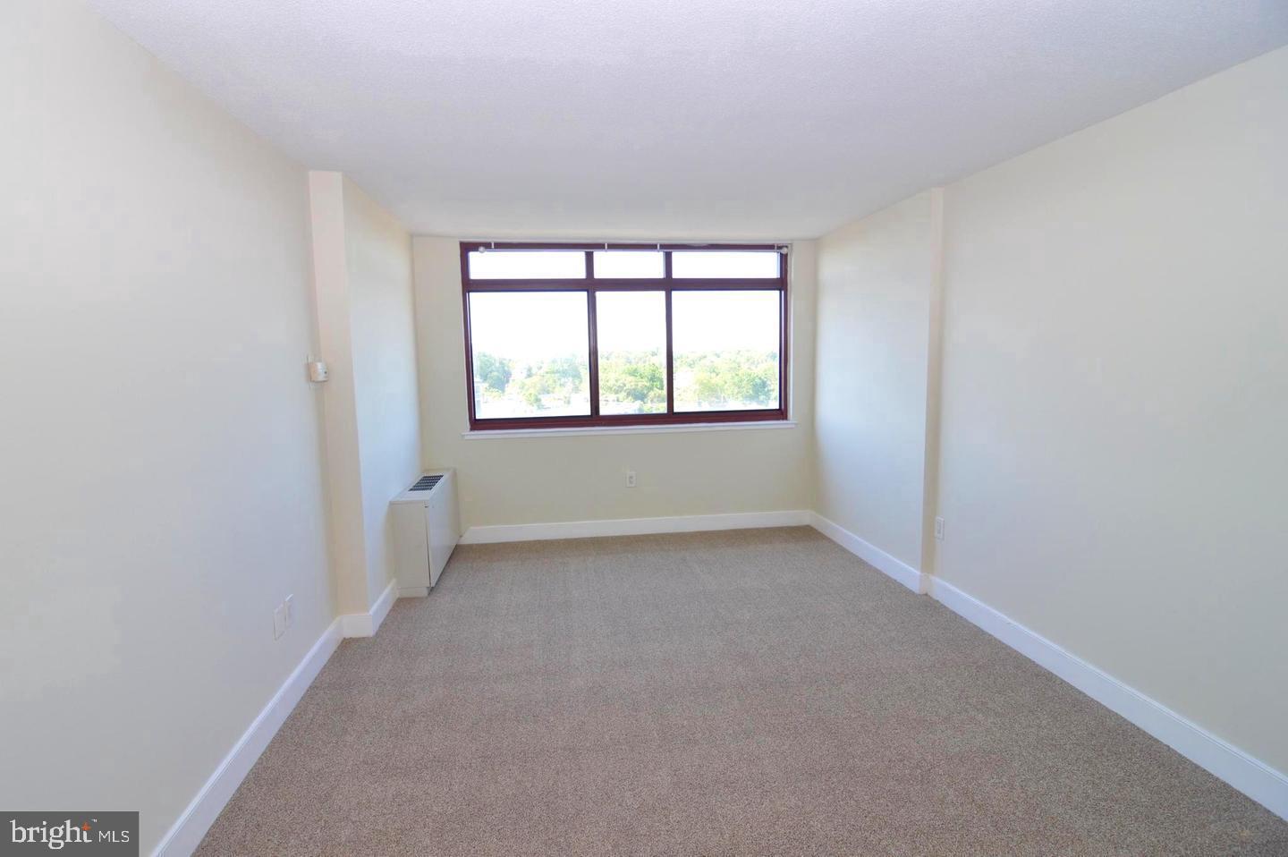 1220 Blair Mill Road, Unit 1007 Silver Spring, MD 20910 - Photo 12 of 27 an empty room with a window