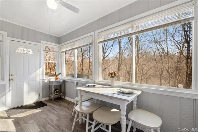 a dining room with a large window and table