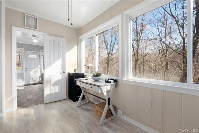 a living room with furniture and a window
