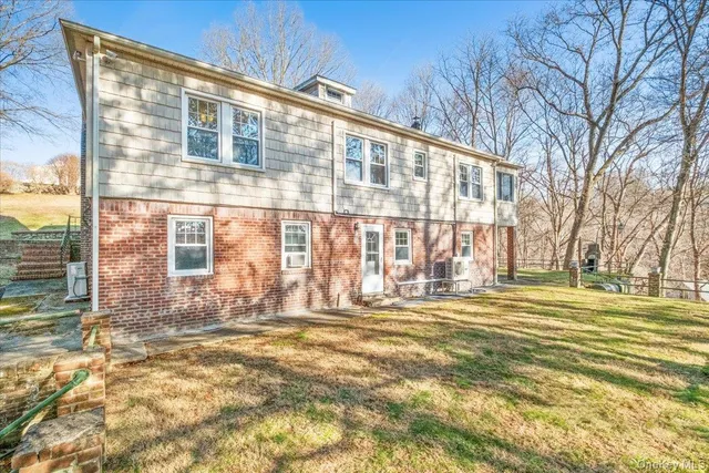 a view of swimming pool with outdoor space and trees in the background
