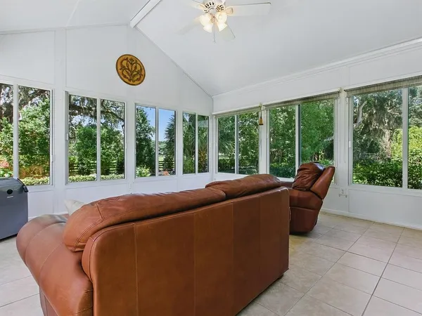 a view of a backyard with sitting area