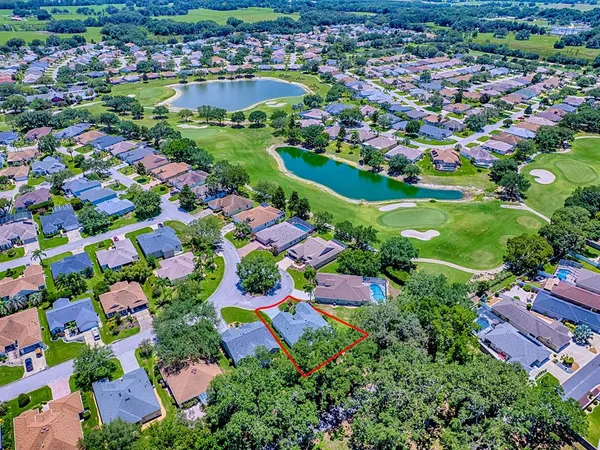 an aerial view of a house with a garden