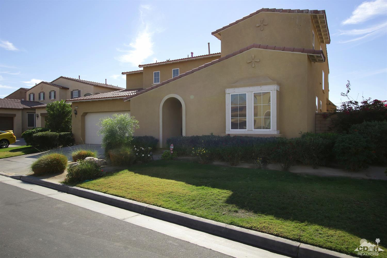 82785 Mount Riley Drive Indio, CA 92203 - Photo 34 of 35 a front view of a house with garden