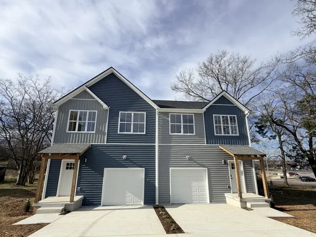 a front view of a house with garage