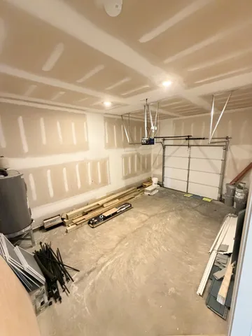 a view of a kitchen with a sink and a refrigerator
