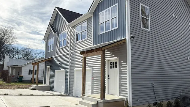 a front view of a house with garage