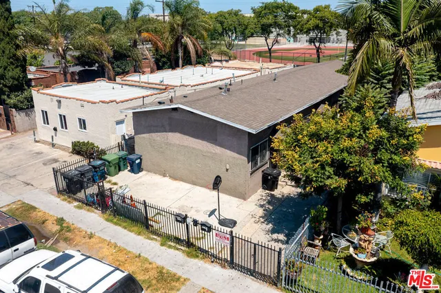 aerial view of a house with yard and patio