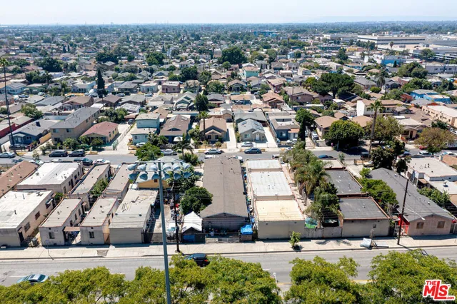 an aerial view of residential houses with outdoor space