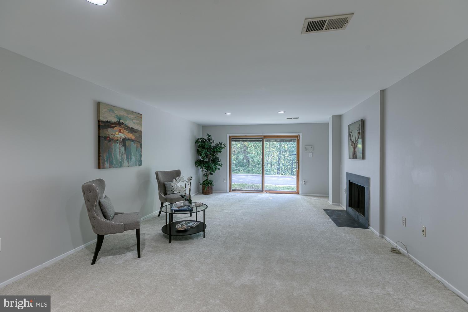 11510 Sunder Court Reston, VA 20190 - Photo 40 of 50 Spacious lower-level family room with fireplace