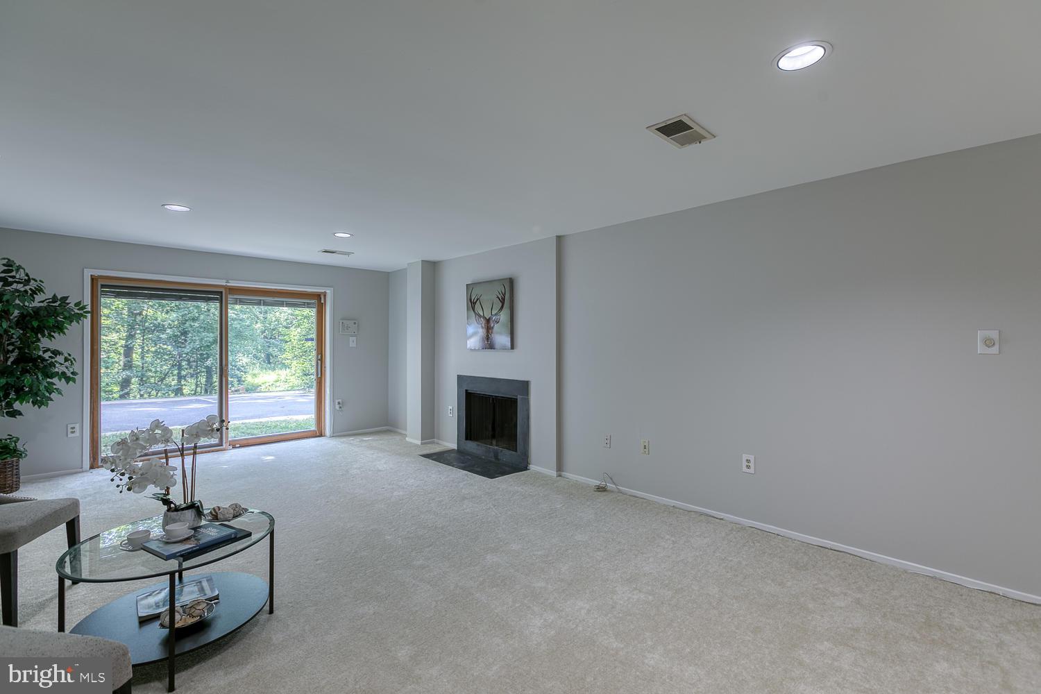 11510 Sunder Court Reston, VA 20190 - Photo 41 of 50 Spacious lower-level family room with fireplace