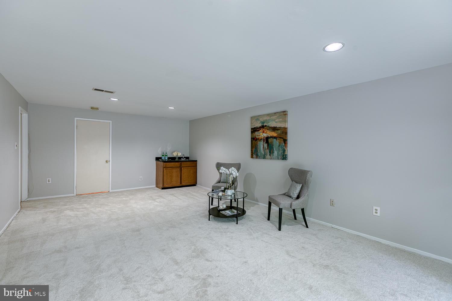 11510 Sunder Court Reston, VA 20190 - Photo 42 of 50 Spacious lower-lvl family room, fireplace, wet bar