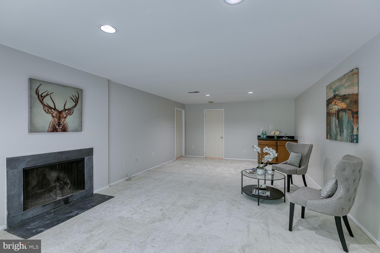 11510 Sunder Court Reston, VA 20190 - Photo 7 of 50 Spacious lower-level family room with fireplace