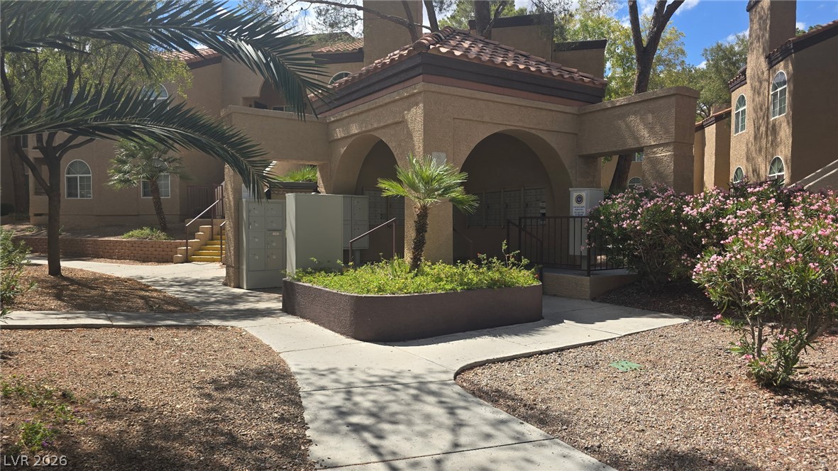 9325 West Desert Inn Road, Unit 123 Las Vegas, NV 89117 - Photo 30 of 36 Archways and tiled roofs welcome residents to this desert oasis community.