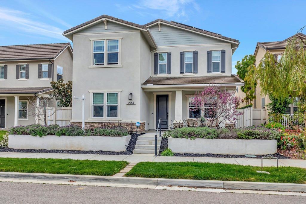 2954 Fledgling Drive Escondido, CA 92029 - Photo 1 of 49 a front view of a house with a yard