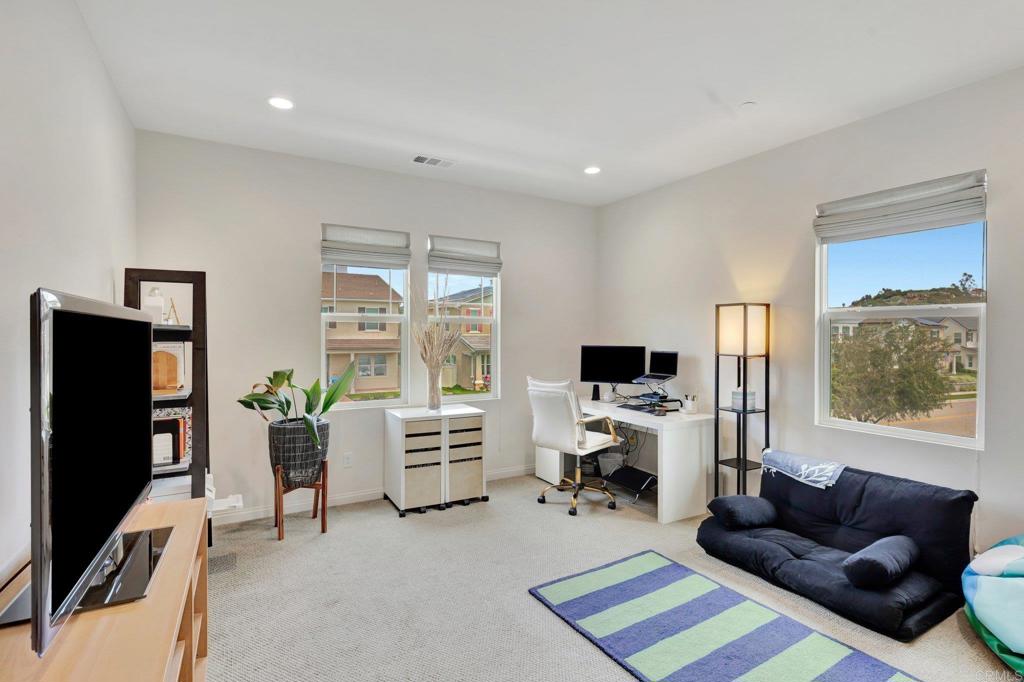 2954 Fledgling Drive Escondido, CA 92029 - Photo 15 of 49 a living room with furniture and a flat screen tv