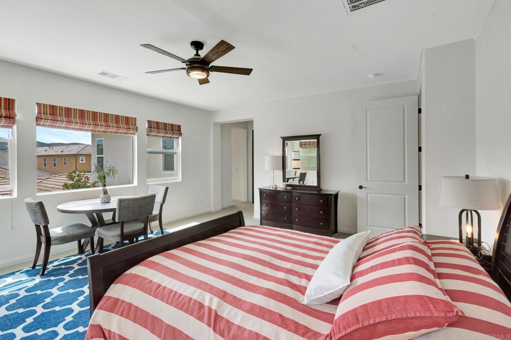 2954 Fledgling Drive Escondido, CA 92029 - Photo 20 of 49 a bedroom with a bed and wooden floor