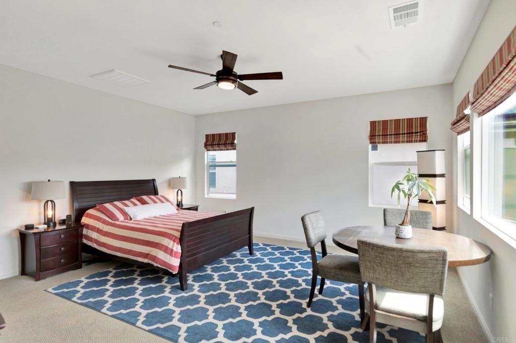 2954 Fledgling Drive Escondido, CA 92029 - Photo 21 of 49 a bedroom with a bed and a window