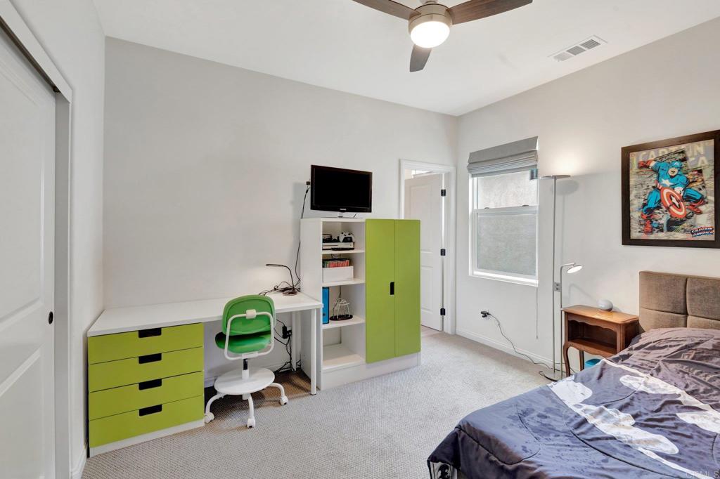 2954 Fledgling Drive Escondido, CA 92029 - Photo 22 of 49 a living room with furniture and a flat screen tv