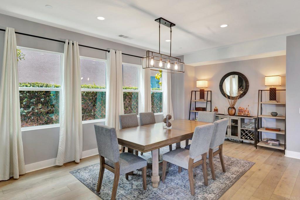 2954 Fledgling Drive Escondido, CA 92029 - Photo 8 of 49 a view of a dining room with furniture window and wooden floor