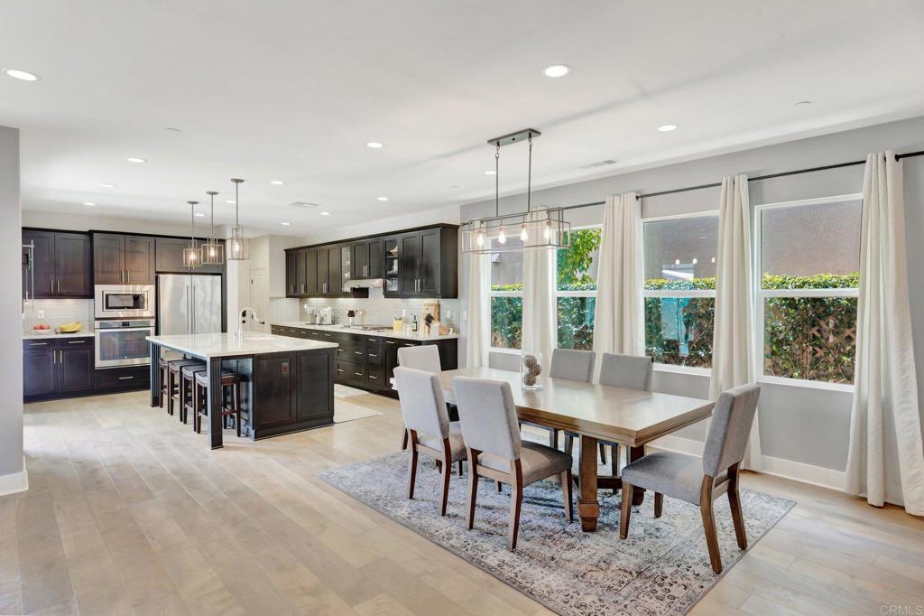 2954 Fledgling Drive Escondido, CA 92029 - Photo 9 of 49 a large kitchen with a table and chairs