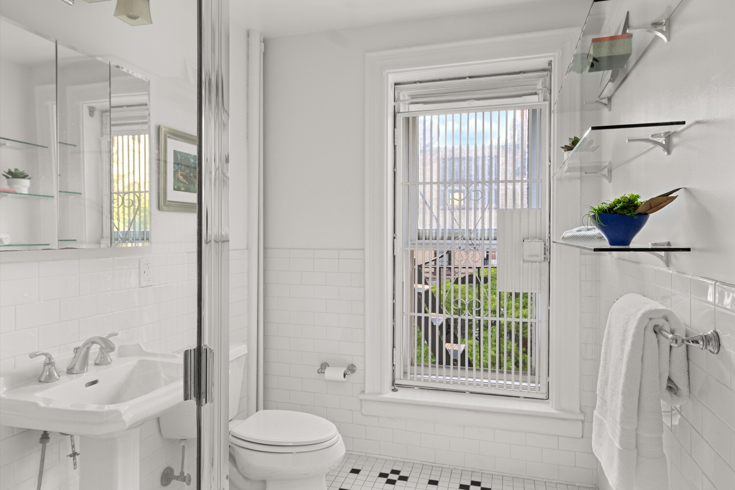 25 Charles Street, Unit 3D Manhattan, NY 10014 - Photo 3 of 13 a bathroom with a sink vanity mirror and toilet