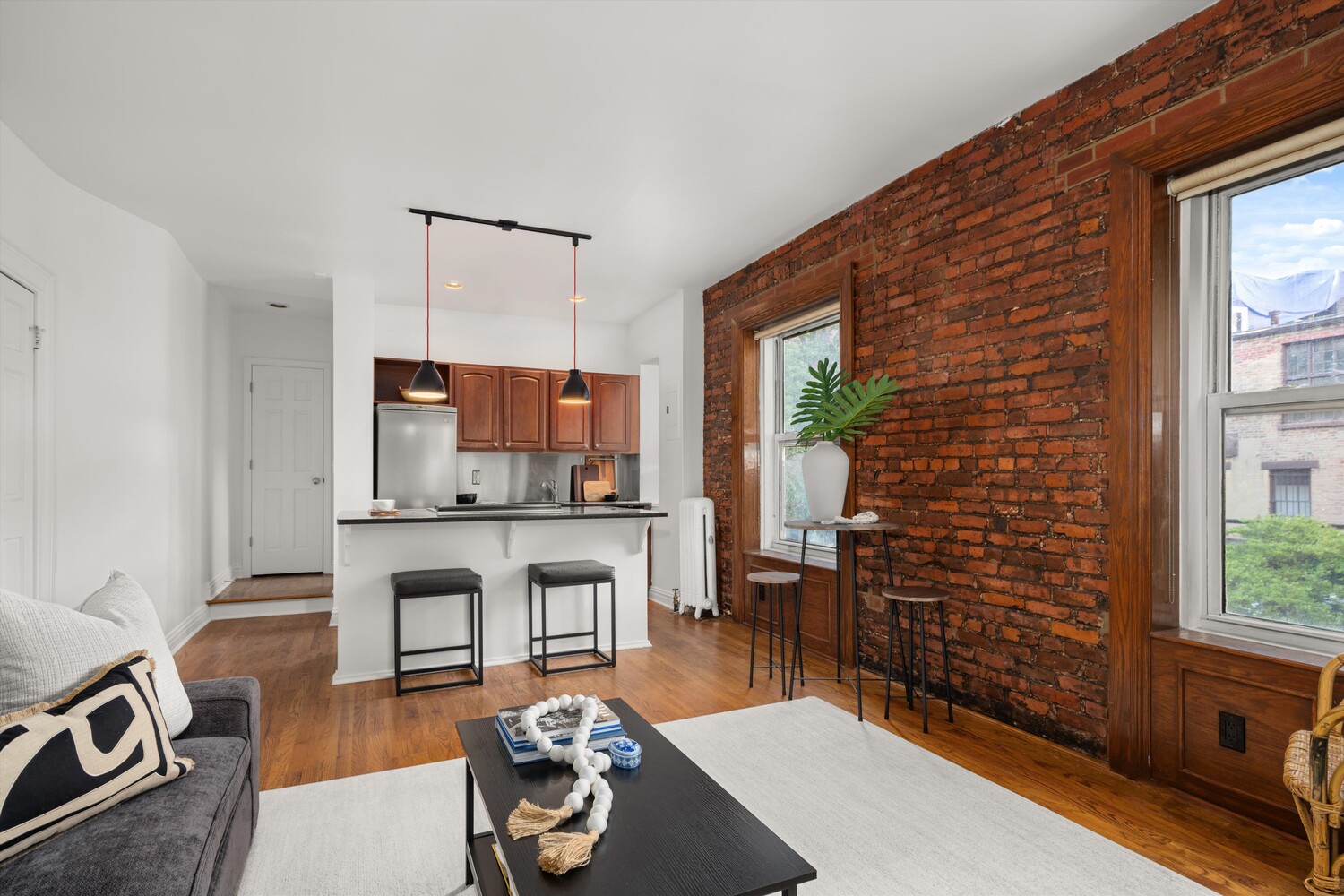 25 Charles Street, Unit 3D Manhattan, NY 10014 - Photo 5 of 13 a living room with furniture a window and a table