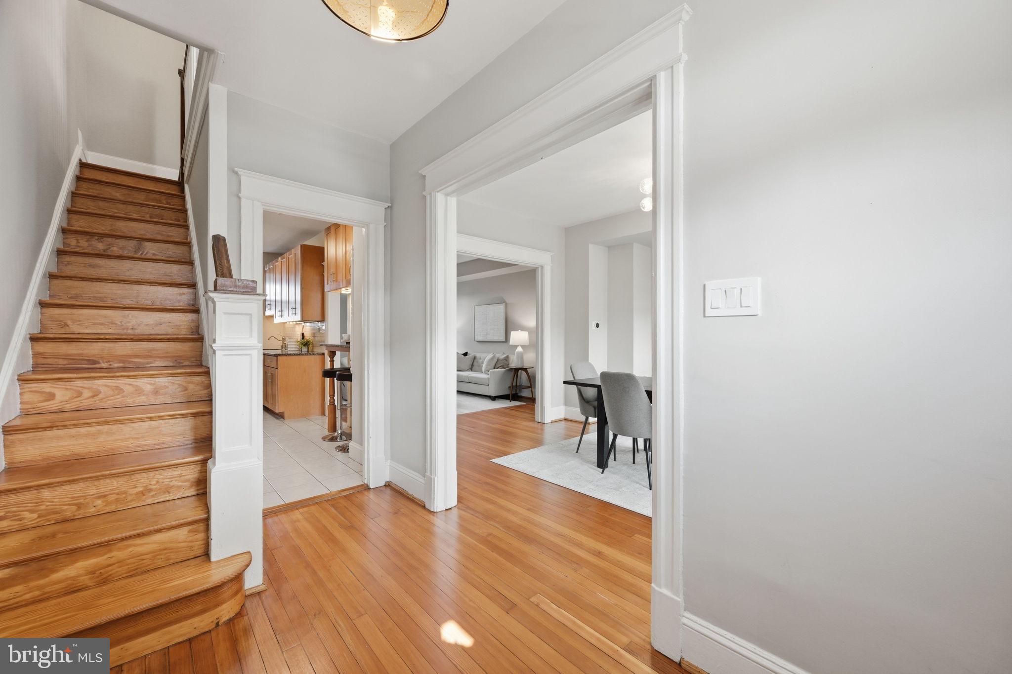 443 Kenyon Street Northwest Washington, DC 20010 - Photo 13 of 30 a view of a hallway view with wooden floor and staircase