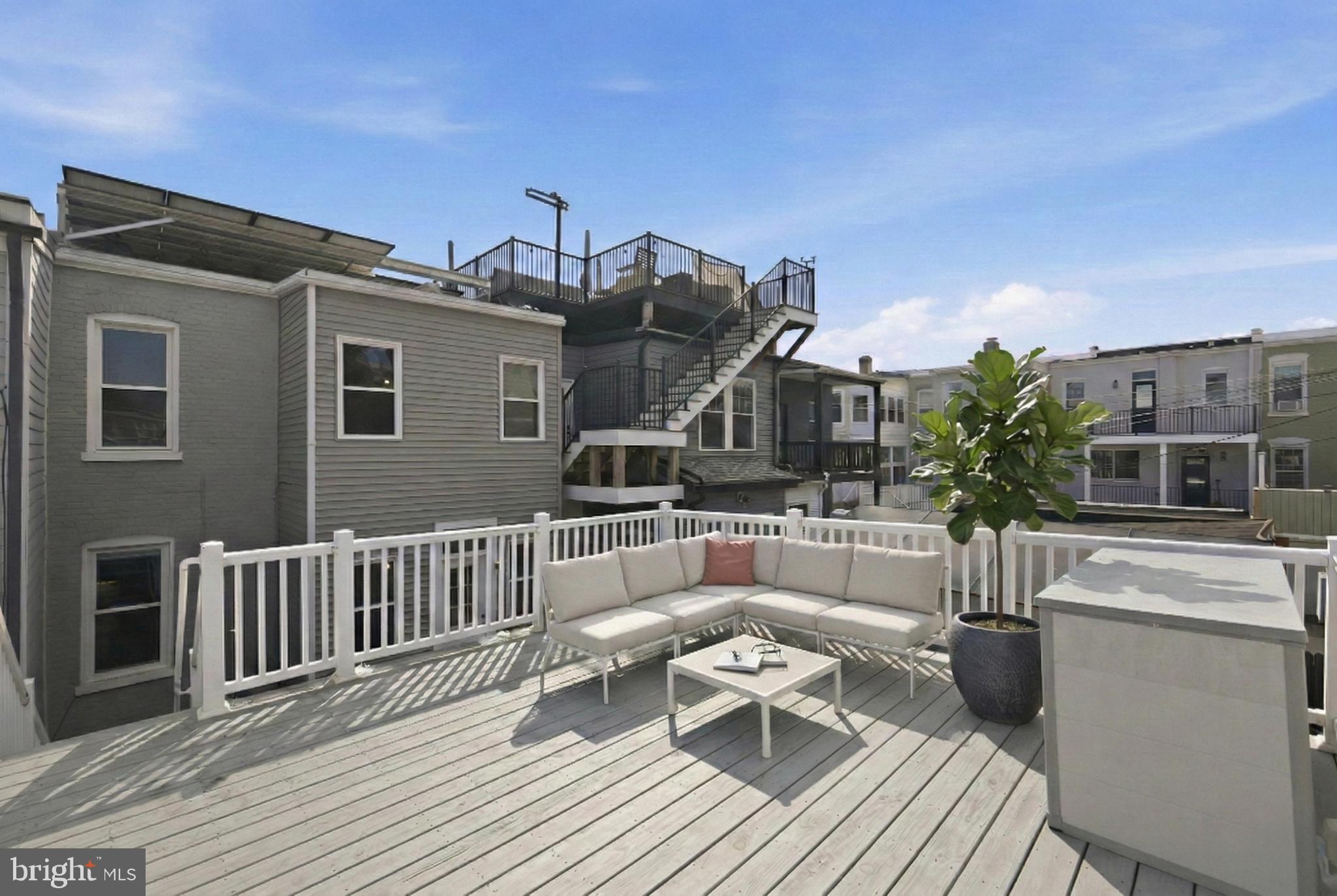443 Kenyon Street Northwest Washington, DC 20010 - Photo 28 of 30 a view of a house with a deck
