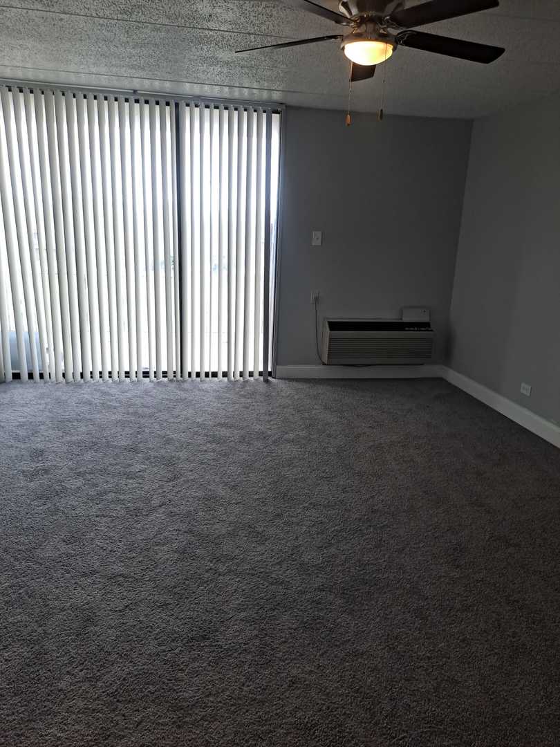 2304 Holiday Terrace, Unit 303 Lansing, IL 60438 - Photo 6 of 11 a view of an empty room with a window