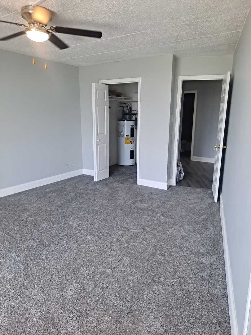 2304 Holiday Terrace, Unit 303 Lansing, IL 60438 - Photo 7 of 11 a view of empty room with fan