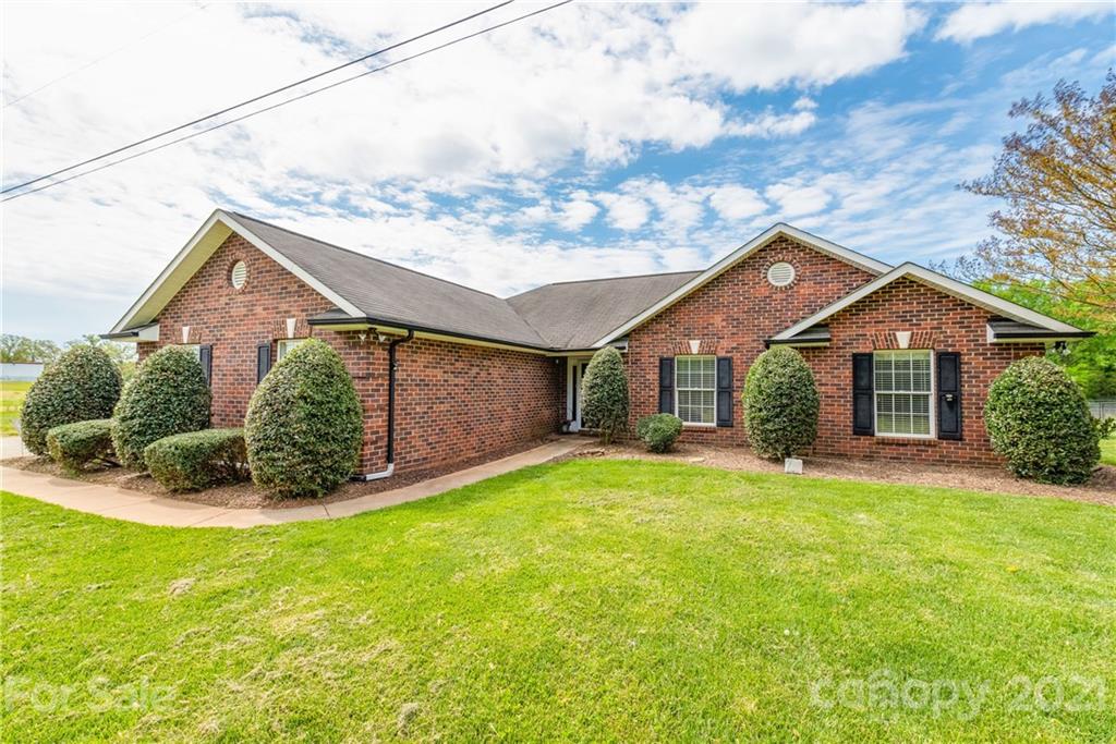 1508 Tom Helms Road Monroe, NC 28110 - Photo 1 of 23 a front view of a house with a yard and garage