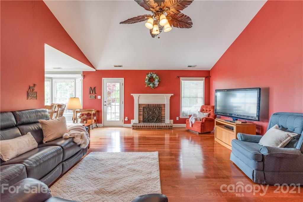 1508 Tom Helms Road Monroe, NC 28110 - Photo 4 of 23 a living room with furniture fireplace and flat screen tv