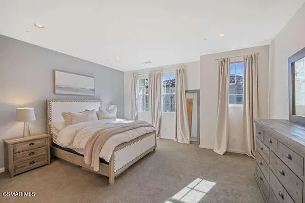 a bed room with a bed and a walk in closet