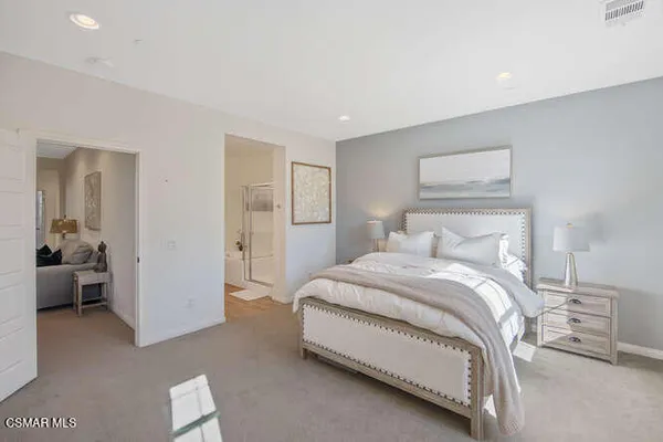 a bedroom with a bed and walk in closet