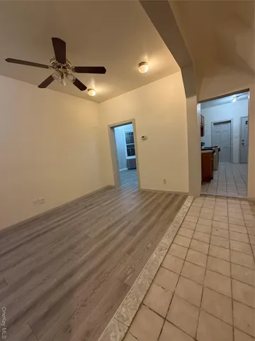a view of a livingroom with a dishwasher cabinets and window