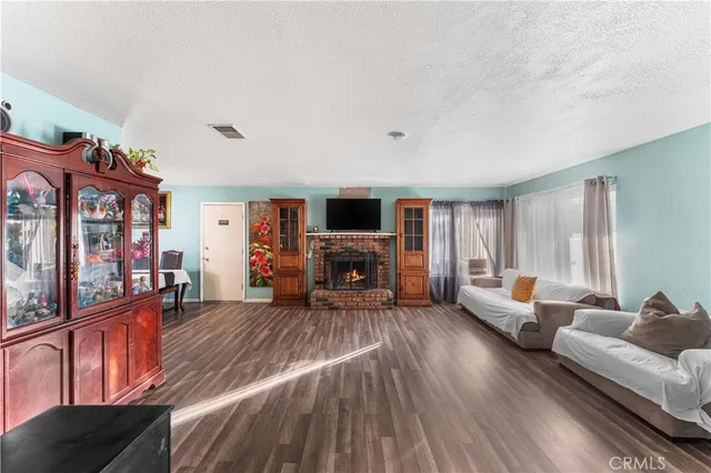 a bedroom with furniture and a flat screen tv