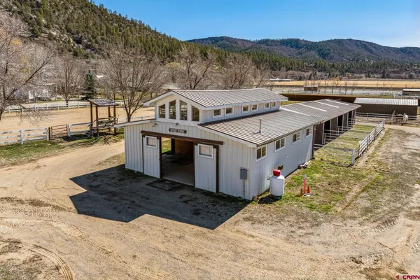 a view of a dining room with furniture and a livingroom