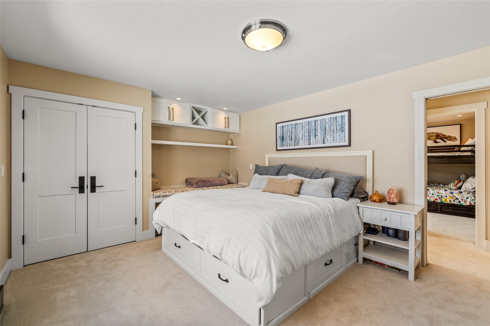 31655 Sugar Ridge Road Steamboat Springs, CO 80487 - Photo 44 of 49 a bedroom with a bed and a lamp